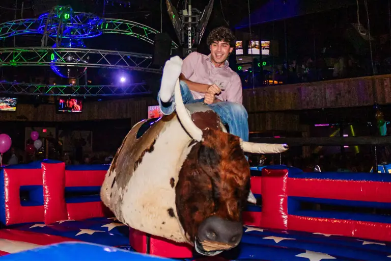 Join the thrill-seekers at Stampede Houston's mechanical bull for a night of laughter and excitement! #NightclubFun #HoustonNightlife #StampedeHoustonThrill