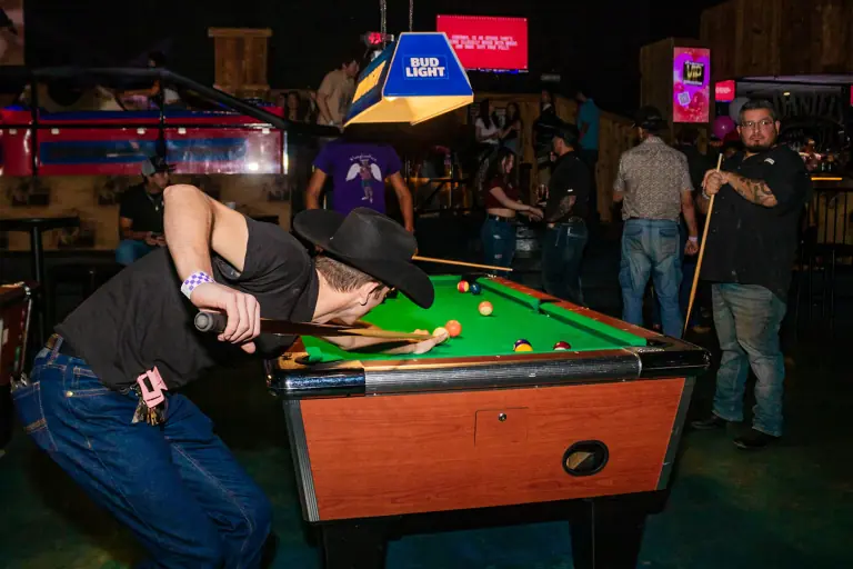 Sink shots and create memories with friends at Stampede Houston's vibrant pool tables! #HoustonNightlife #NightclubFun #StampedeHoustonPool